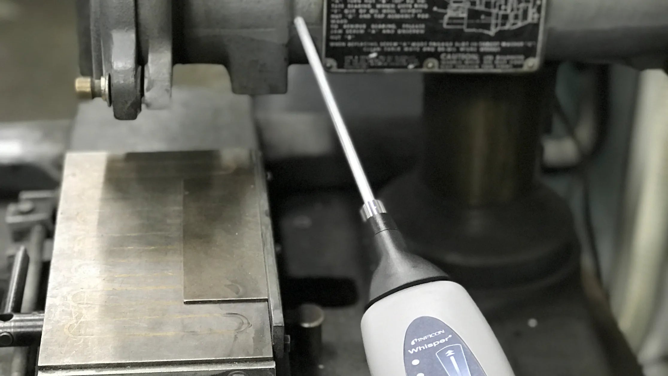 Whisper with Kit by INFICON Ultrasonic Leak Detector in Use 